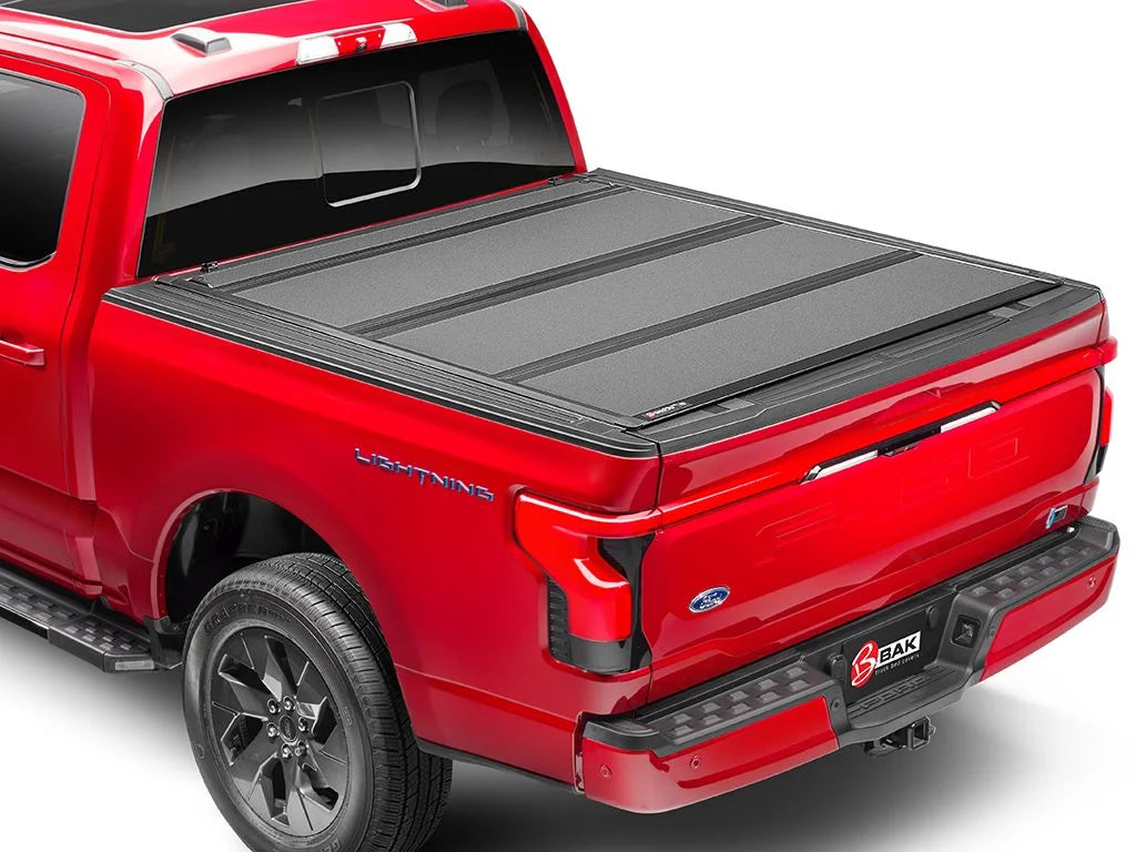 BAK by RealTruck BAKFlip MX4 Hard Folding Truck Bed Tonneau shield | 448525 | matching with 2017 - 2023 Nissan Titan 5' 7" Bed (67")